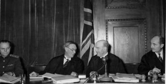 Members of the Nuremberg Tribunal Iona Nikitchenko (USSR), Norman Birkett and Geoffrey Lawrence (UK) and Francis Biddle (US)