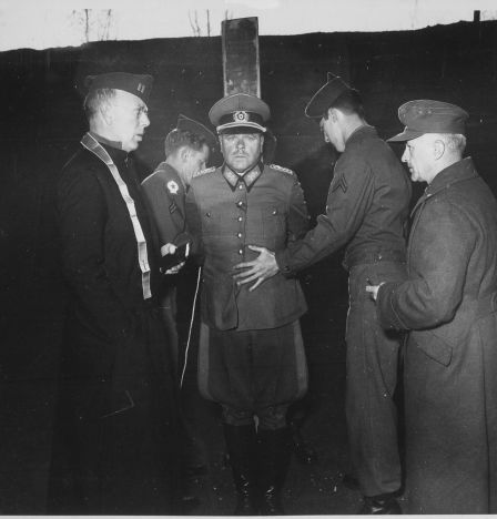 German General Anton Dostler is tied to a stake before his execution by a firing squad in the Aversa stockade. The General was convicted and sentenced to death by an American military tribunal. Aversa, Italy.