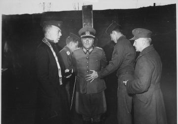 German General Anton Dostler is tied to a stake before his execution by a firing squad in the Aversa stockade. The General was convicted and sentenced to death by an American military tribunal. Aversa, Italy.