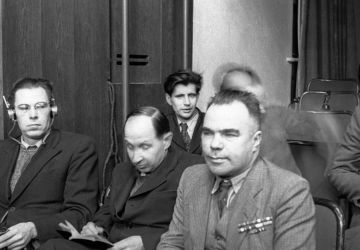 Writer Vsevolod Vishnevsky and artists of the Kukryniksy collective Porfiry Krylov and Mikhail Kupriyanov (from right to left) sit in a courtroom. The Nuremberg trial.