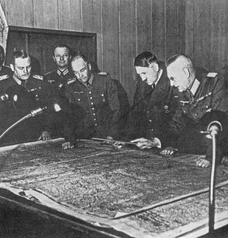 Field Marshal W. Keitel, Colonel General W. von Brauchitsch, A. Hitler, Colonel General F. Halder (from left to right) near the table with a map during a meeting of the General Staff. In 1940, Adolf Hitler signed Basic Directive 21, codenamed “Barbarossa”.