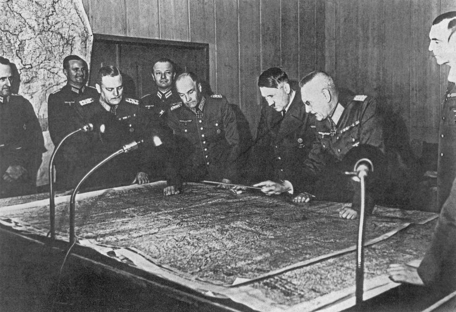 Field Marshal W. Keitel, Colonel General W. von Brauchitsch, A. Hitler, Colonel General F. Halder (from left to right) near the table with a map during a meeting of the General Staff. In 1940, Adolf Hitler signed Basic Directive 21, codenamed “Barbarossa”.