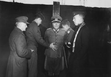 German General Anton Dostler is tied to a stake before his execution by a firing squad in the Aversa stockade. The General was convicted and sentenced to death by an American military tribunal. Aversa, Italy., 12/01/1945