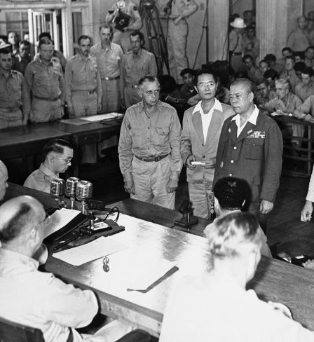 Lieutenant General Tomoyuki Yamashita, second from right, faces the military commission in a courtroom in Manilla, Philippines, on Dec. 7, 1945, as he sentenced to death by hanging by Major General Russell Reynolds, seated lower left.