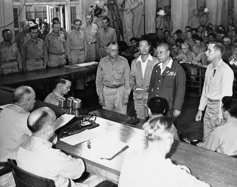 Lieutenant General Tomoyuki Yamashita, second from right, faces the military commission in a courtroom in Manilla, Philippines, on Dec. 7, 1945, as he sentenced to death by hanging by Major General Russell Reynolds, seated lower left.