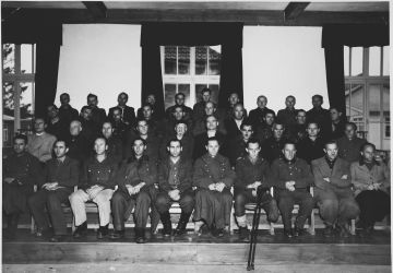 Group portrait of the defendants in the Dachau war crimes trial.