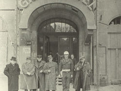 At the entrance to the Grand Hotel in Nuremberg.  Second from the left is Soviet writer and journalist V. Vishnevsky, third from the left is Soviet director R. Karmen.  The Russian State Archives of Literature and Arts.