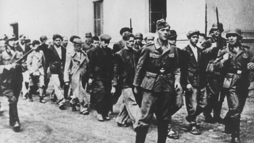 Germans escort people from Kragvjevac and its surrounding area to be executed