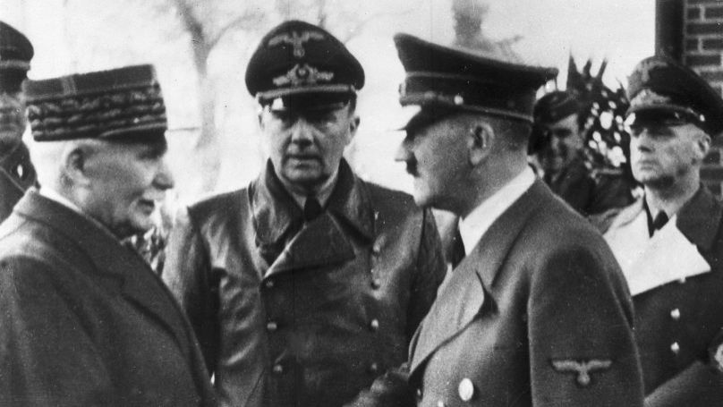 Adolf Hitler and Philippe Pétain’s meeting in occupied France. German Foreign Minister Joachim von Ribbentrop on the far right. 24 October 1940. © AP Photo