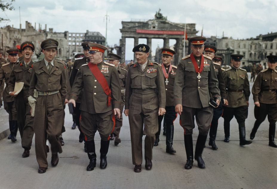 The Deputy Supreme Commander in Chief of the Red Army, Marshal G. Zhukov, the Commander of the 21st Army Group, Field Marshal Sir Bernard Montgomery, Marshal K. Rokossovsky and General Sokolovsky of the Red Army leave the Brandenburg Gate after the ceremony, 12 July 1945.