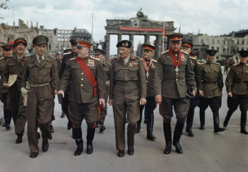 The Deputy Supreme Commander in Chief of the Red Army, Marshal G. Zhukov, the Commander of the 21st Army Group, Field Marshal Sir Bernard Montgomery, Marshal K. Rokossovsky and General Sokolovsky of the Red Army leave the Brandenburg Gate after the ceremony, 12 July 1945.