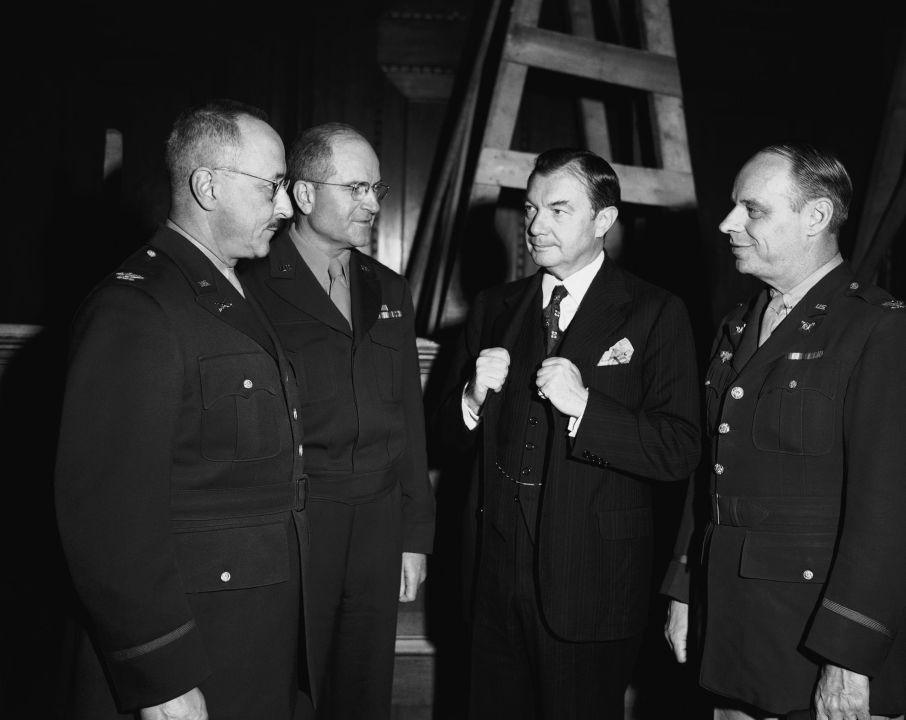 Supreme Court Justice Robert H. Jackson (third from left), chief U.S. war crimes prosecutor, discusses plans for trials of persons accused of war crimes with three colonels in Nuernberg, Germany, Sept. 28, 1945, where the trials are expected to start about November 1. From Left to right are: Col. B. C. Andrus, in charge of the prison and prisoners at Nuernberg; Col. Robert G. Storey, chief of the documents section of the war crimes commission, Jackson, and Col. John Harlen Amen, head of the interrogation force of the war crimes commission.