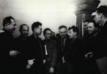 Procurator General of the Soviet Union Roman Rudenko on a smoke break with journalists.