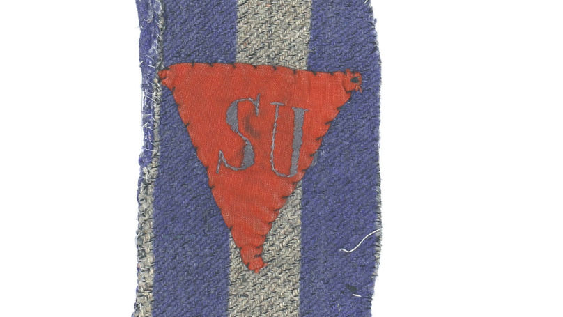 A winkel patch with the letters "SU" on a piece of clothing of concentration camp prisoner Grigorieva Antonina Dmitrievna