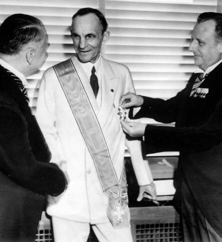 German diplomats award Henry Ford, center, Nazi Germany's highest decoration for foreigners, The Grand Cross of the German Eagle, in Detroit on July, 30, 1938 for his  service  to the Third Reich.  Karl Kapp, German consul in Cleveland pins the medal while Fritz Heiler, left, German consul in Detroit shakes his hand. General Motors Corp. and Ford Motor Co. deny helping the Nazis during World War II and profiting from forced labor at their German subsidiaries.  (AP Photo)