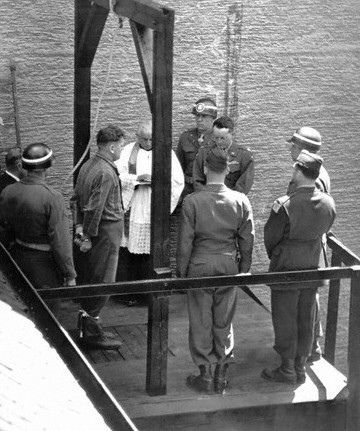 Catholic priest Karl Morgenschweis praying for a prisoner on the gallows at Landsberg Prison