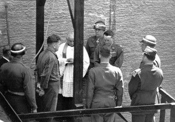 Catholic priest Karl Morgenschweis praying for a prisoner on the gallows at Landsberg Prison