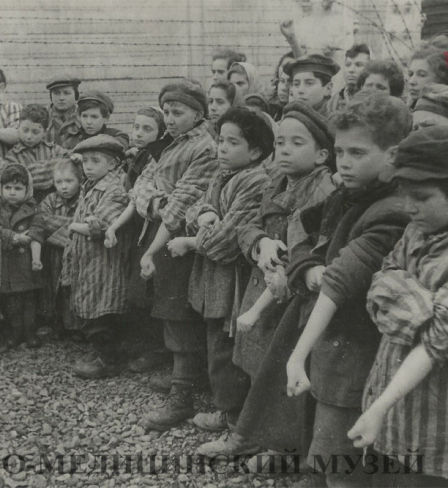 Children at a concentration camp wait for their blood to be taken by Nazi doctors