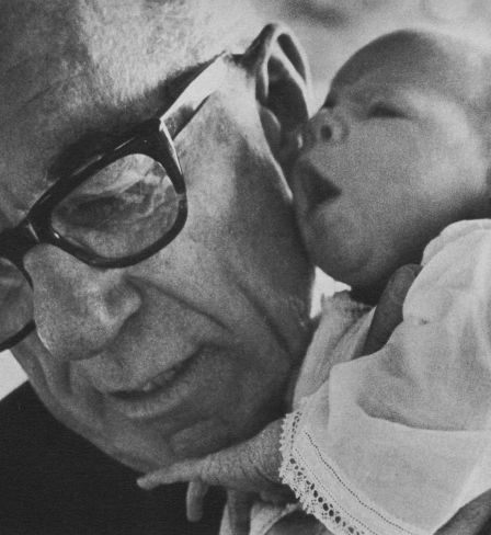 Benjamin Spock, American paediatrician (with his first granddaughter, Susannah)