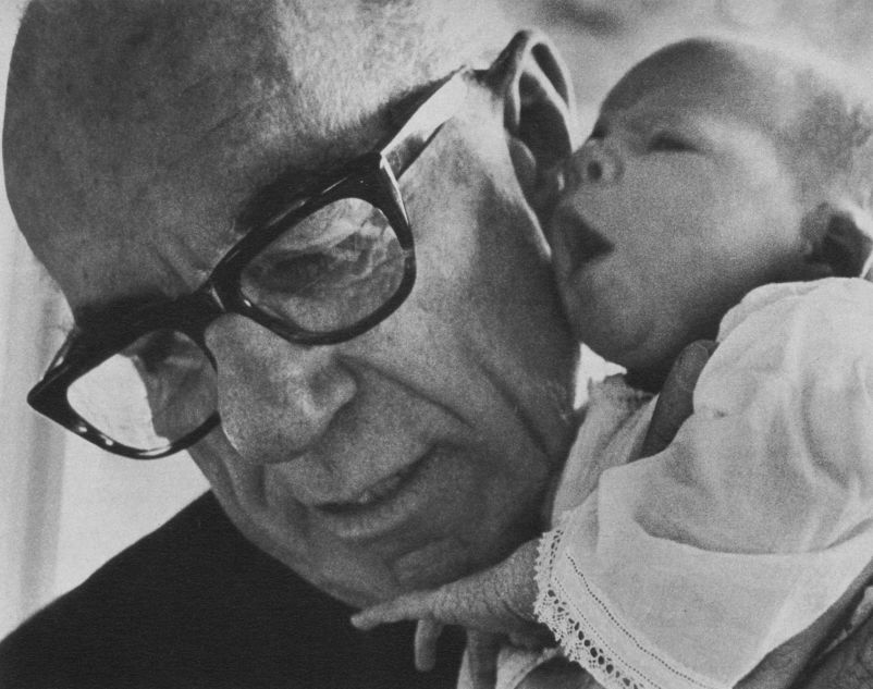 Benjamin Spock, American paediatrician (with his first granddaughter, Susannah)