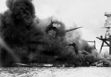 The USS Arizona (BB-39) burning after the Japanese attack on Pearl Harbor, 7 December 1941. 