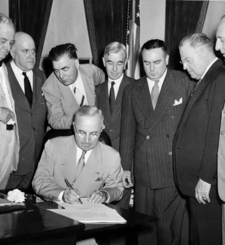 President Harry S. Truman signs the Atomic Energy Act of 1946