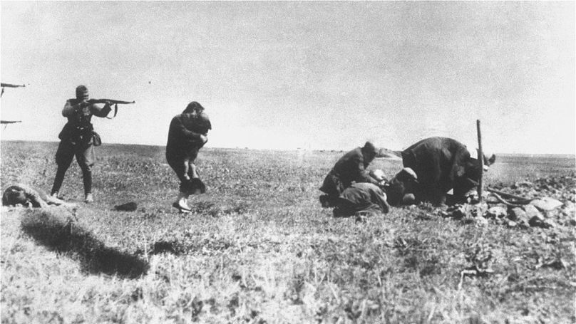 Einsatzgruppen members shooting Jews, Ukraine, 1942