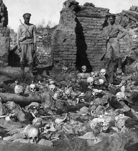 Russian soldiers pictured over the remains of Armenians burned alive in the Armenian village of Sheykhalan (also spelt Sheyxalan) during the Armenian Genocide