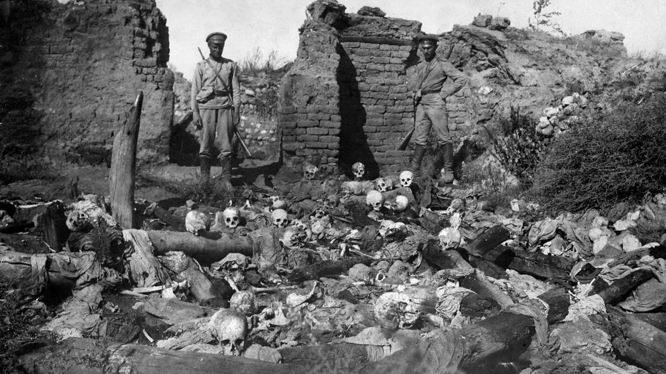 Russian soldiers pictured over the remains of Armenians burned alive in the Armenian village of Sheykhalan (also spelt Sheyxalan) during the Armenian Genocide